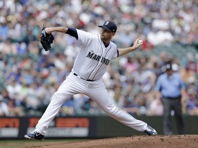 Seattle Mariners starting pitcher James Paxton works against the Colorado Rockies during the first inning of a baseball game, Saturday, July 7, 2018, in Seattle.