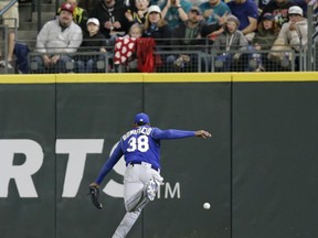 Kansas City Royals right fielder Jorge Bonifacio chases the ball hit by Seattle Mariners' Denard Span for an RBI double during the third inning of a baseball game Saturday, June 30, 2018, in Seattle.
