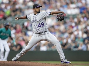 Colorado Rockies starting pitcher German Marquez delivers during the first inning of a baseball game against the Seattle Mariners, Friday, July 6, 2018, in Seattle.