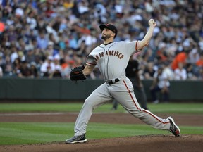San Francisco Giants starting pitcher Andrew Suarez throws to a Seattle Mariners batter during the first inning of a baseball game Tuesday, July 24, 2018, in Seattle.