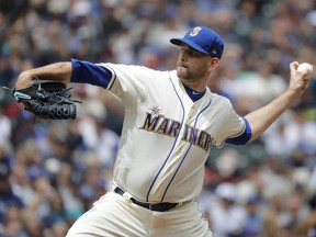 Seattle Mariners starting pitcher James Paxton throws against the Kansas City Royals during the first inning of a baseball game, Sunday, July 1, 2018, in Seattle.
