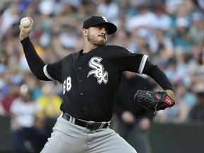 Chicago White Sox starting pitcher Dylan Covey throws against the Seattle Mariners during the first inning of a baseball game, Saturday, July 21, 2018, in Seattle.