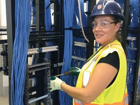 There is a huge demand for networking cabling specialists like Ashley Porter, above. Network cabling is a skilled trade that provides a rewarding and challenging career.