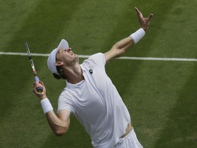 Kevin Anderson of South Africa serves to Andreas Seppi of Italy during their men's singles match on the fourth day at the Wimbledon Tennis Championships in London, Thursday July 5, 2018.