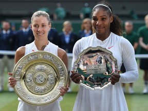 Winner Angelique Kerber of Germany and runner-up Serena Williams of The United States pose with the trophies after the Ladies' Singles final on day twelve of the Wimbledon Lawn Tennis Championships at All England Lawn Tennis and Croquet Club on July 14, 2018 in London, England.