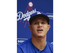 Los Angeles Dodgers' Manny Machado speaks at a news conference before a baseball game against the Milwaukee Brewers Friday, July 20, 2018, in Milwaukee.