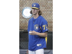Milwaukee Brewers relief pitcher Josh Hader warms up before a baseball game against the Los Angeles Dodgers Friday, July 20, 2018, in Milwaukee.