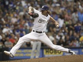 Milwaukee Brewers relief pitcher Josh Hader throws during the seventh inning of a baseball game against the Los Angeles Dodgers Saturday, July 21, 2018, in Milwaukee.
