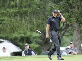 Phil Mickelson scratches his head after missing his putt on the seventh hole during the second round of the A Military Tribute at The Greenbrier in West Virginia  golf tournament in White Sulphur Springs, W.Va., Friday, July 6, 2018.