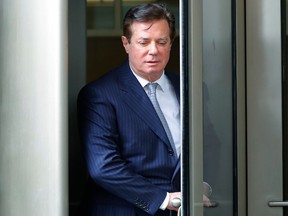 FILE - In this Feb. 14, 2018, file photo, Paul Manafort leaves the federal courthouse in Washington. The trial of President Donald Trump's former campaign chairman will open this week with tales of lavish spending on properties and clothing and allegations that the political consultant laundered money through offshore bank accounts. What's likely to be missing: answers about whether the Trump campaign colluded with Russia during the 2016 presidential election.