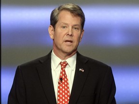 FILE - IN this May 20, 2018, file photo, Georgia Republican gubernatorial candidate Brian Kemp participates in a debate in Atlanta. President Donald Trump's surprise endorsement of Kemp is the latest example of the president diving deep into GOP primary politics. Kemp was surprised by the endorsement over his opponent in the runoff, Casey Cagle.