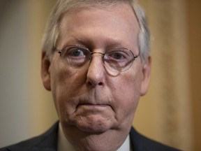 FILE - In this May 15, 2018, file photo, Senate Majority Leader Mitch McConnell, R-Ky., pauses as he speaks to reporters at the Capitol in Washington. In a surprise move, McConnell has withdrawn one of President Donald Trump's judicial nominees just minutes before he was set for a confirmation vote. McConnell announced July 19, 2018, that he was pulling the nomination of Ryan Bounds.