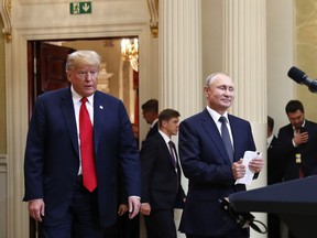 In this July 16, 20198, photo, U.S. President Donald Trump, left, and Russian President Vladimir Putin arrive for a news conference at the Presidential Palace in Helsinki, Finland. Trump has asked national security adviser John Bolton to invite Putin to Washington in the fall. That's the latest update Thursday from White House press secretary Sarah Huckabee Sanders following Trump's meeting with Putin earlier this week in Finland.
