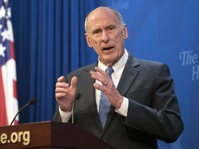 FILE - In this Oct. 13, 2017, file photo, Director of National Intelligence Dan Coats speaks at a Heritage Foundation event in Washington. Coats' drumbeat of criticism against Russia is clashing loudly with President Donald Trump's pro-Kremlin remarks, leaving the soft-spoken spy chief in an uncomfortable _ and perhaps perilous _ seat in the administration.