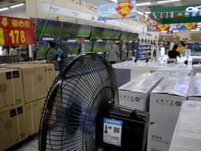 Chinese brand home appliances sit on display for sale at a hypermarket in Beijing, Wednesday, July 11, 2018. China's government has criticized the latest U.S. threat of a tariff hike as "totally unacceptable" and vowed to retaliate in their escalating trade war. The Commerce Ministry on Wednesday gave no details, but Beijing responded to last week's U.S. tariff hike on $34 billion of imports from China by increasing its own duties on the same amount of American goods.