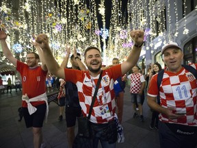 Croatia fans celebrate their team victory after the semifinal soccer match between Croatia and England during the 2018 soccer World Cup in Nikolskaya street near the Kremlin in Moscow, Russia, Thursday, July 12, 2018.