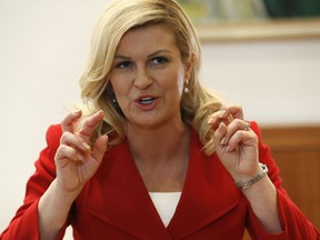 Croatian President Kolinda Grabar-Kitarovic gestures durning an interview with the Associated Press at the 2018 soccer World Cup, at the Croatian embassy in Moscow, Russia, Sunday, July 15, 2018. Croatia's president says that no matter what happens in the World Cup final, the unexpected success of her small country's hard-working, underdog team means that "we're a winner."
