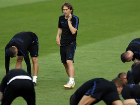 Croatia's Luka Modric looks at his teammates during a training session of Croatia at the 2018 soccer World Cup in Moscow, Russia, Saturday, July 14, 2018.