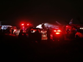 A charter plane lays in a field in Pretoria, South Africa, Tuesday July 10, 2018. The plane crashed killing one person and injuring 20 others with injuries ranging from minor to critical, according to Russel Meiring, a spokesman for paramedic company ER24.