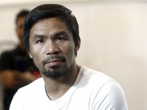 Philippine senator and boxing champion Manny Pacquiao trains at a press preview in Kuala Lumpur, Malaysia, Wednesday, July 11, 2018. Pacquiao is scheduled to fight Lucas Matthysse on July 15, 2018, for the World Boxing Association welterweight title in Malaysia.