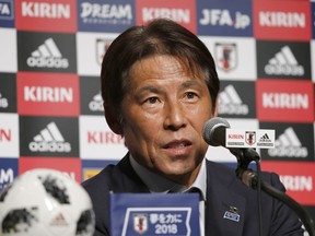 Japanese soccer team coach Akira Nishino speaks during a press conference upon his team's return from the World Cup in Russia, at a hotel in Narita, near Tokyo, Thursday, July 5, 2018.