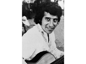 FILE - In this undated file photo, Chilean singer and songwriter Victor Jara poses for a portrait in an unknown location in Chile. A judge in Chile has sentenced eight retired soldiers to 18 years in prison for the kidnapping and murder of the well-known folklorist, which occurred during the chaotic first days of Chile's 1973 coup, according to the court's communications office on Tuesday, July 4, 2018.
