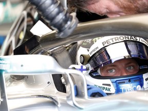 Mercedes driver Valtteri Bottas of Finland waits at pits during the second free practice session for the Hungarian Formula One Grand Prix, at the Hungaroring racetrack in Mogyorod, northeast of Budapest, Friday, July 27, 2017. The Hungarian Grand Prix will be held on Sunday.