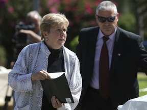 UN envoy Jane Holl Lute arrives at the presidential palace for a meeting with Cyprus' president Nikos Anastasiades in the divided capital of Nicosia, Cyprus, Monday, July 23, 2018. Lute holds talks with ethnically divided Cyprus' rival leaders to gauge prospects for a resumption of moribund reunification talks.