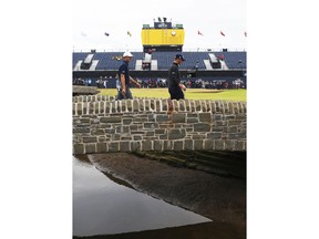 Jordan Spieth of the United States, left, and Justin Thomas of the United States walk towards the 18th green during a practice round for the 147th Open golf Championship at Carnoustie golf club, Scotland, Tuesday, July 17th 2018.