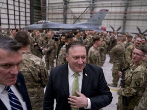 FILE - In this Monday, July 9, 2018 file photo, Secretary of State Mike Pompeo meets with coalition forces at Bagram Air Base, Afghanistan. Peace in Afghanistan seems even more elusive, both for troops on the front lines of this war-battered country and for survivors of countless attacks, since the Taliban shrugged off the government's latest offers of cease-fire and negotiations. They maintain the only talks they would take part in would be with the United States on their key demand: the withdrawal of all American forces from Afghanistan.