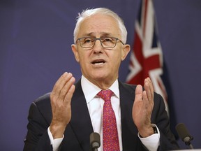 Australia's Prime Minister Malcolm Turnbull comments at the government offices in Sydney, Thursday, July 19, 2018. Turnbull called on Pope Francis to fire an Australian archbishop who is the most senior Roman Catholic cleric ever convicted for covering up child sexual abuse.