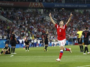 Russia's Denis Cheryshev celebrates after scoring his side's first goal during the quarterfinal match between Russia and Croatia at the 2018 soccer World Cup in the Fisht Stadium, in Sochi, Russia, Saturday, July 7, 2018.