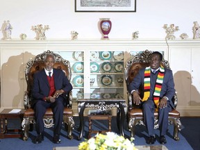 Members of the The Elders foundation Kofi Annan, left, meets with Zimbabwean President Emmerson Mnangagwa at State House in Harare, Zimbabwe, Friday, July, 20, 2018. The visit to Zimbabwe is a key focus of concern for The Elders in providing support as the country prepares to hold elections on July 30.