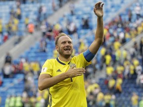 Sweden's Andreas Granqvist waves to the fans after the round of 16 match between Switzerland and Sweden at the 2018 soccer World Cup in the St. Petersburg Stadium, in St. Petersburg, Russia, Tuesday, July 3, 2018. Sweden won 1-0.