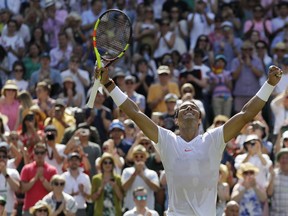 Rafael Nadal of Spain celebrates winning his men's singles match against Australia's Alex de Minaur, on the sixth day of the Wimbledon Tennis Championships in London, Saturday, July 7, 2018.