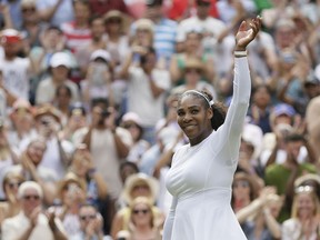 Serena Williams of the United States celebrates winning her women's singles match against Russia's Evgeniya Rodina, on day seven of the Wimbledon Tennis Championships, in London, Monday July 9, 2018.
