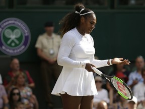 Serena Williams of the United States is dejected after losing a point to Germany's Angelique Kerber during their women's singles final match at the Wimbledon Tennis Championships, in London, Saturday July 14, 2018.