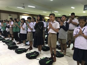 Students pray at Maesaiprasitsart school where six out of the rescued 12 boys study as they cheer the successful rescue in the Mae Sai district in Chiang Rai province, northern Thailand, Wednesday, July 11, 2018. A daring rescue mission in the treacherous confines of a flooded cave in northern Thailand has saved all 12 boys and their soccer coach who were trapped deep within the labyrinth, ending a grueling 18-day ordeal that claimed the life of an experienced volunteer diver and riveted people around the world.