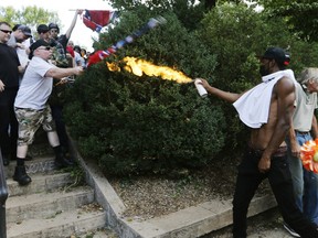 The white nationalists were holding the rally to protest plans by the city of Charlottesville to remove a statue of Confederate Gen. Robert E. Lee. Gov. Terry McAuliffe declared a state of emergency after chaotic violent clashes broke out between the groups.