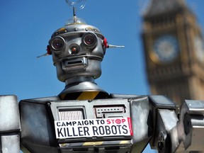 A file photo taken on April 23, 2013 shows a mock 'killer robot' pictured in central London during the launching of the Campaign to Stop Killer Robots, which calls for the ban of lethal robot weapons that would be able to select and attack targets without any human intervention.