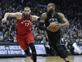 Milwaukee Bucks' Greg Monroe drives past Toronto Raptors' Jonas Valanciunas during the second half of game 3 of their NBA first-round playoff series basketball game Thursday, April 20, 2017, in Milwaukee. (AP Photo/) ORG XMIT: WIMG115