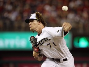 In this July 17 file photo, Milwaukee Brewers reliever Josh Hader pitches in the MLB all-star game.