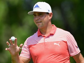 Gary Woodland acknowledges the crowd after making a par on the ninth green during the second round of the PGA Championship on Friday at Bellerive Country Club in St Louis.