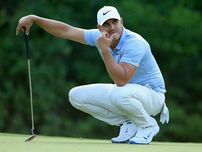 Brooks Koepka lines up a putt on the 17th green on Saturday during the third round of the PGA Championship at Bellerive Country Club in St Louis.