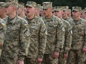 Ukrainian soldiers attend the opening ceremony of the Rapid Trident bilateral military exercises between the United States and Ukraine that include troops from a variety of NATO and non-NATO countries on September 15, 2014 near Yavorov, Ukraine.
