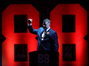 In this Jan. 18 file photo, Eric Lindros salutes the crowd during his Philadelphia Flyers jersey retirement ceremony.