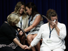 Victims of clergy sexual abuse, or their family members react as Pennsylvania Attorney General Josh Shapiro speaks during a news conference at the Pennsylvania Capitol in Harrisburg, Pa., Aug. 14, 2018.