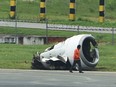A torn-off engine pod from a XiamenAir Boeing 737-800 series passenger aircraft, operating as flight MF8667 from Xiamen to Manila, is seen after the aircraft slid off the runway while attempting to land in bad weather at the Manila international airport on August 17, 2018.