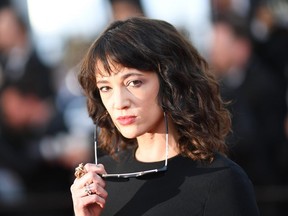 In this file photo taken on May 19, 2018 Italian actress Asia Argento poses as she arrives for the closing ceremony and the screening of the film "The Man Who Killed Don Quixote" at the 71st edition of the Cannes Film Festival in Cannes, southern France.