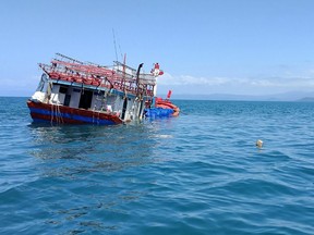 This handout photo from the Port Douglas Marine Rescue taken and released on August 27, 2018 shows an abandoned fishing boat in the Daintree near Cape Kimberley in Queensland.
